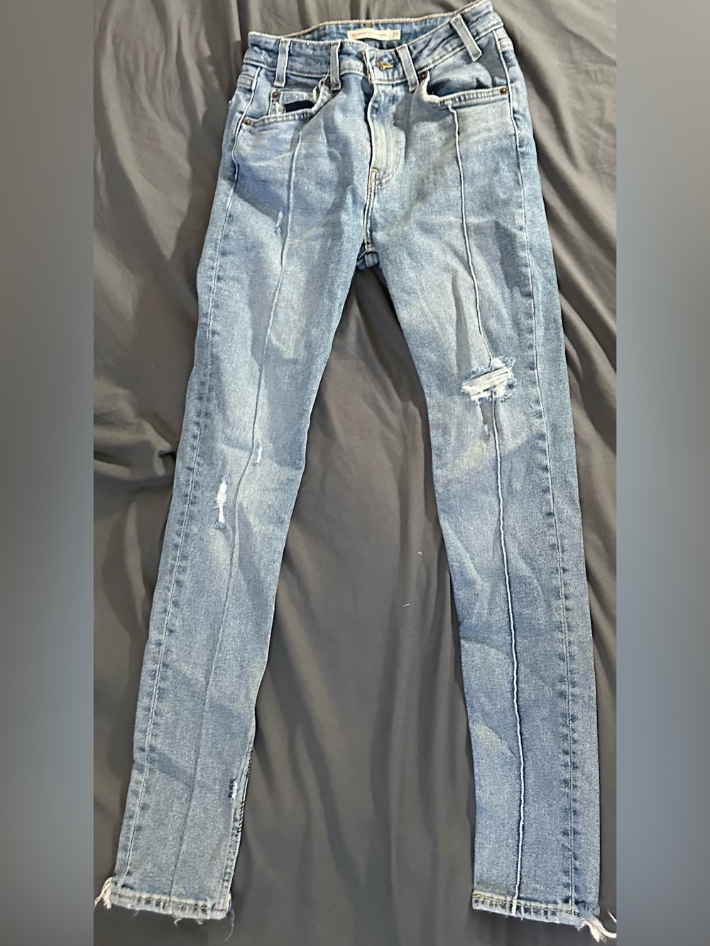Levi’s Light Blue Skinny Jeans with Front Seam and Distressed Details